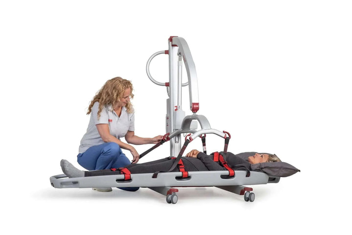 Molift - Mobile Scoop Stretcher lady being placed in stretcher with white background
