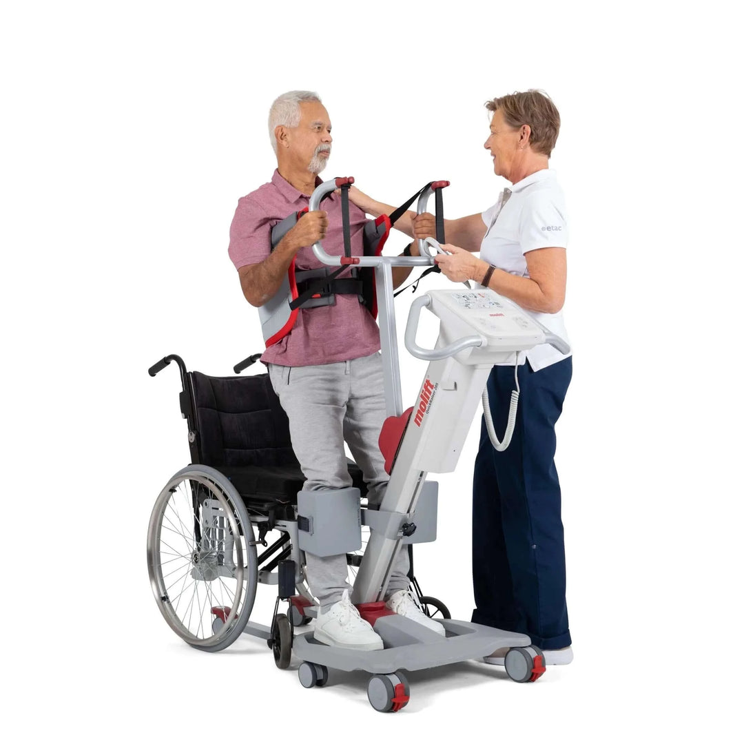 Molift - Quick Raiser 205 Sit-To-Stand Patient Lift - patient being helped out of wheelchair by nurse