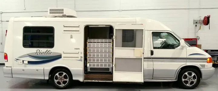 Roll-A-Ramp Powered Van Ramp for Mini and Full Size Van Ramps for AF1 and MF1 Ramps at Reliable Ramps being used with an RV