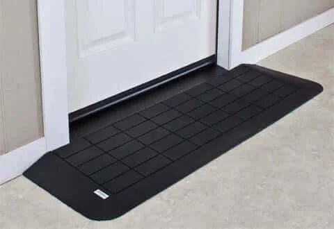 American Access - Rubber Threshold Ramp for Wheelchairs - ramp in front of a white door