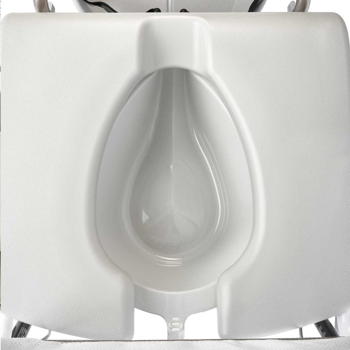 Close-up of a white urinal with a blurred background