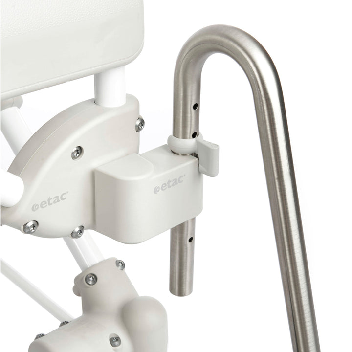 White stairlift with metal handrail on a white background
