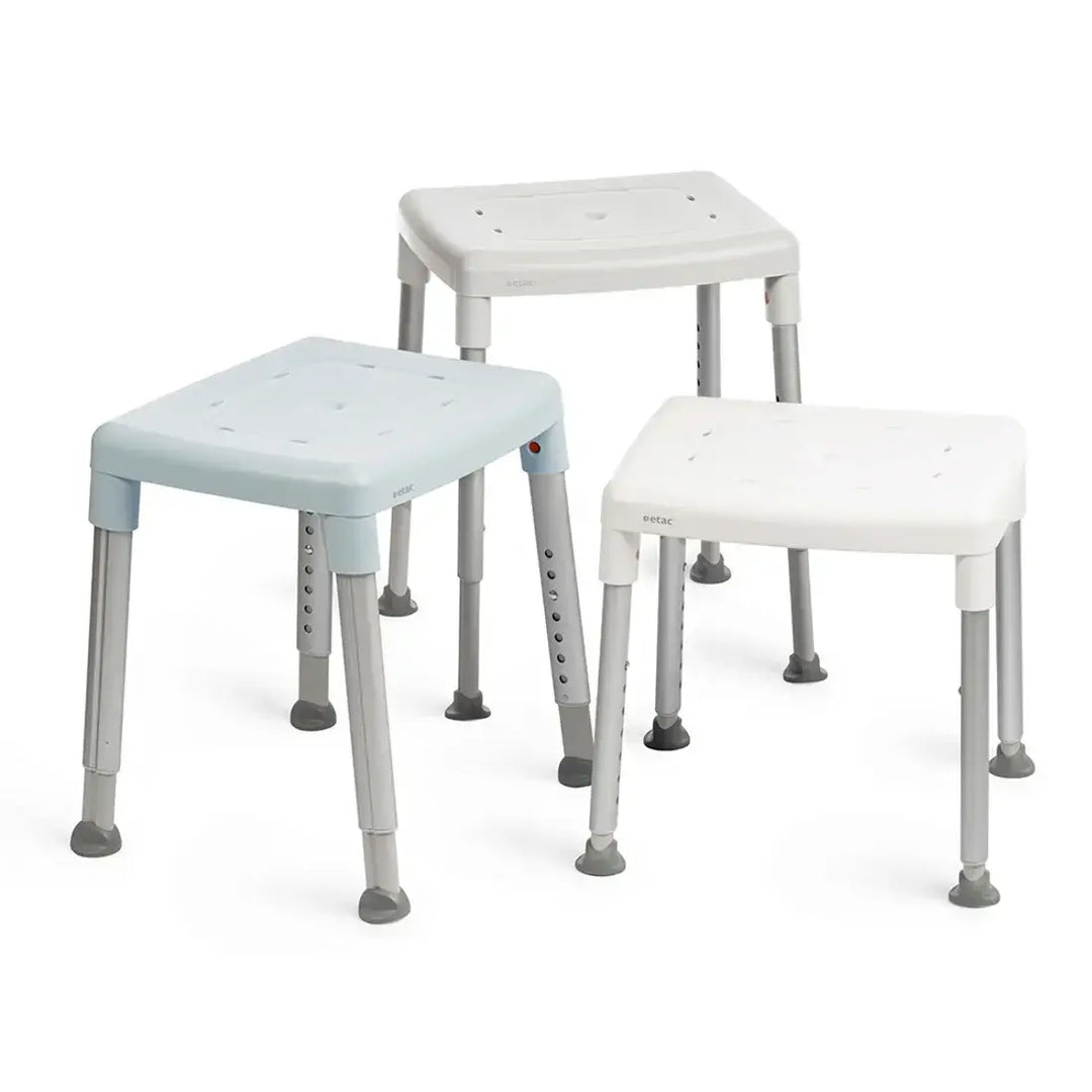 etac smart shower stool on reliable ramps showing 3 separate colors on a white background