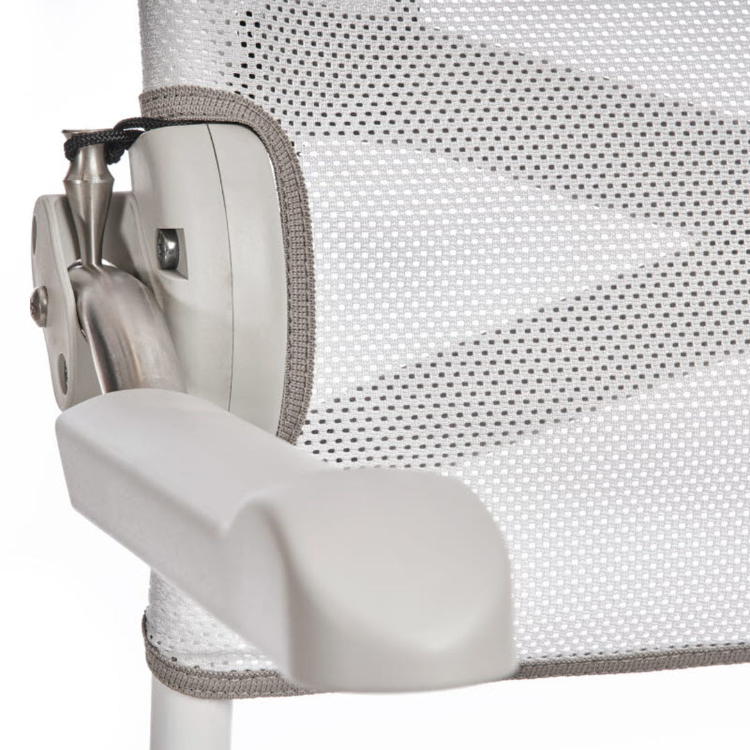 Close-up of a chair armrest with mesh backrest