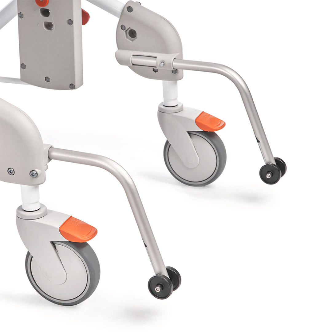 Close-up of a medical device with wheels and orange accents on a white background