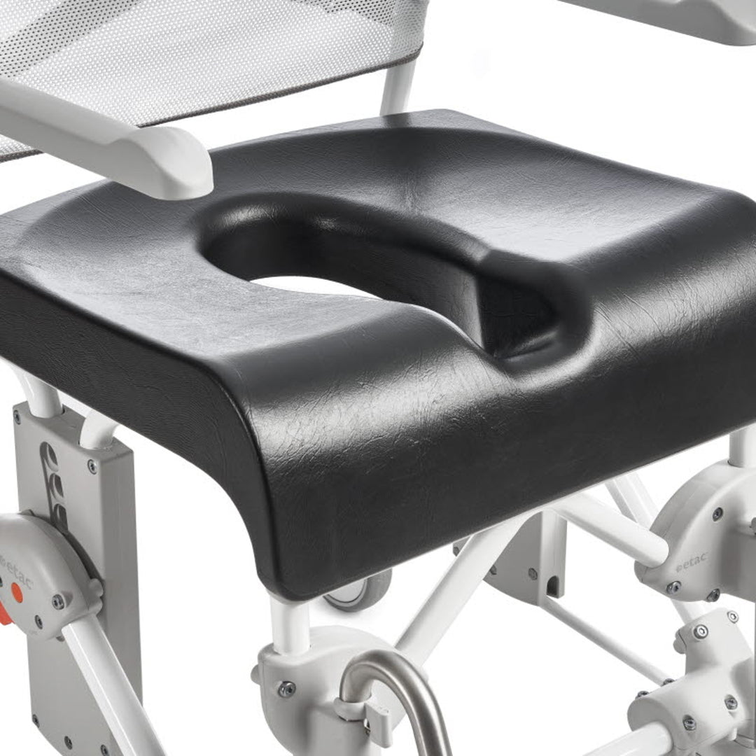 Black seat cushion on a medical chair with white frame