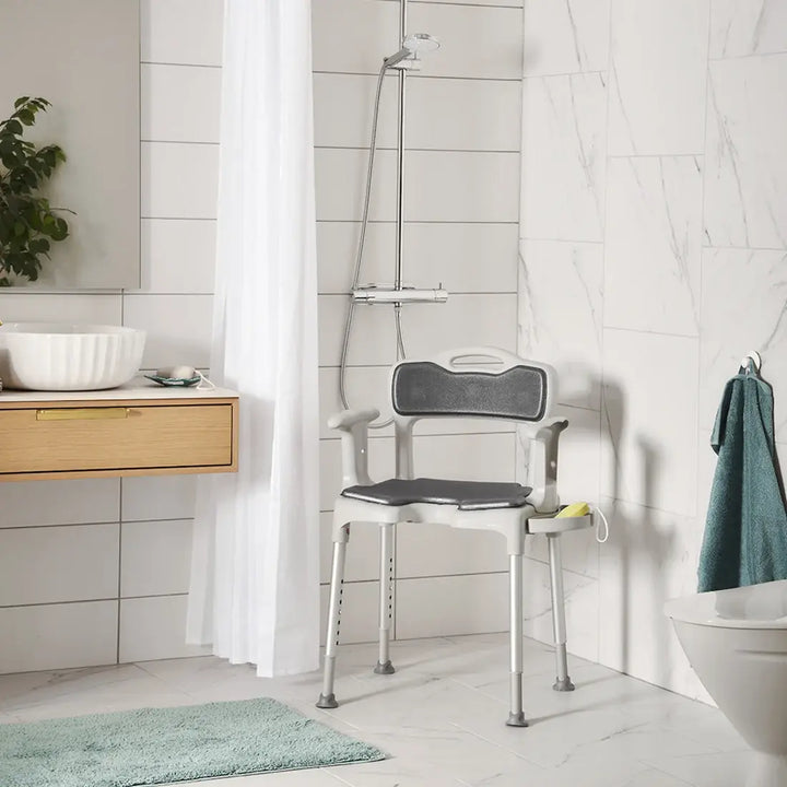 etac swift shower stool/chair from reliable ramps showing the padded back in a shower