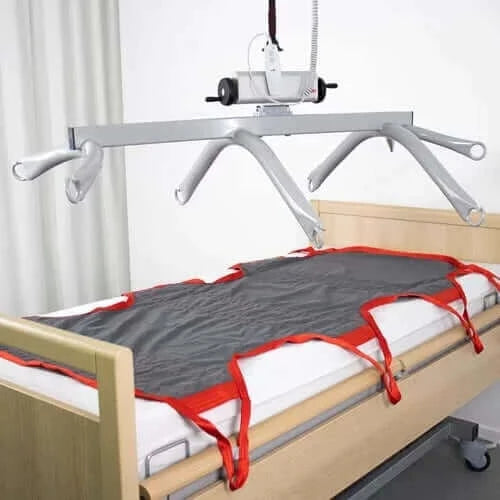 Molift - 8-Point Sling Bar hovering over bed with the cloth stretcher on it