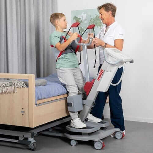 Molift - Quick Raiser 205 Sit-To-Stand Patient Lift - child being helped by nurse out of bed