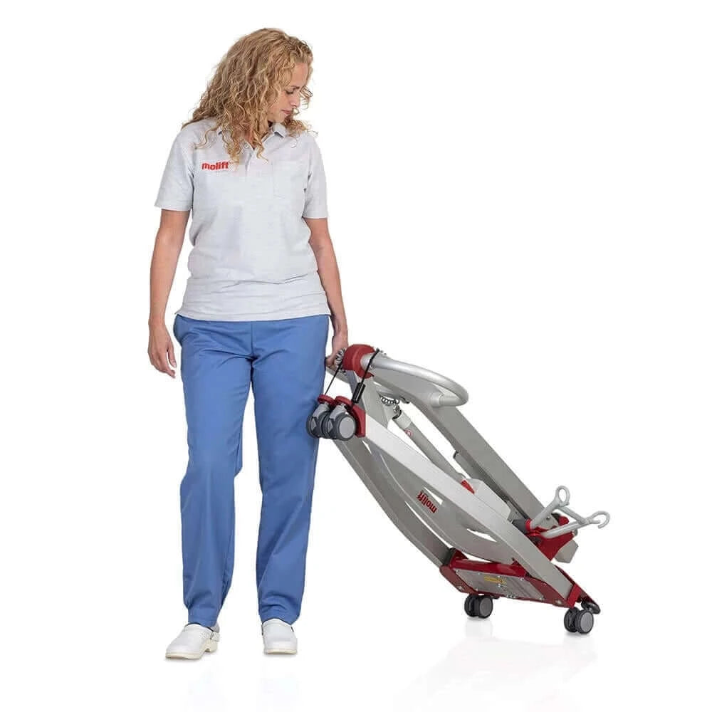 Molift - Smart 150 Patient Lift folded up being held by a nurse