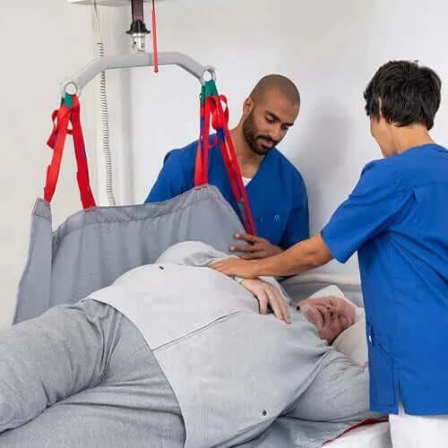 Molift - RgoSling Repositioning Sheet Patient Lifts Accessories Molift with 2 nurses helping a patient