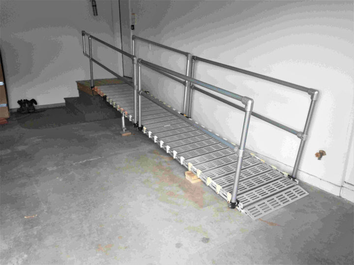 roll-a-ramp portable aluminum wheelchair ramp at reliable ramps in a garage with handrails