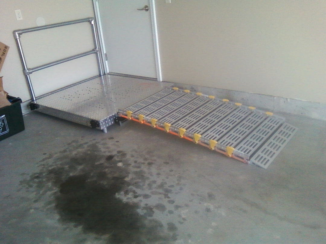 roll-a-ramp portable aluminum wheelchair ramp at reliable ramps short ramp with no handrails in a garage and a platform