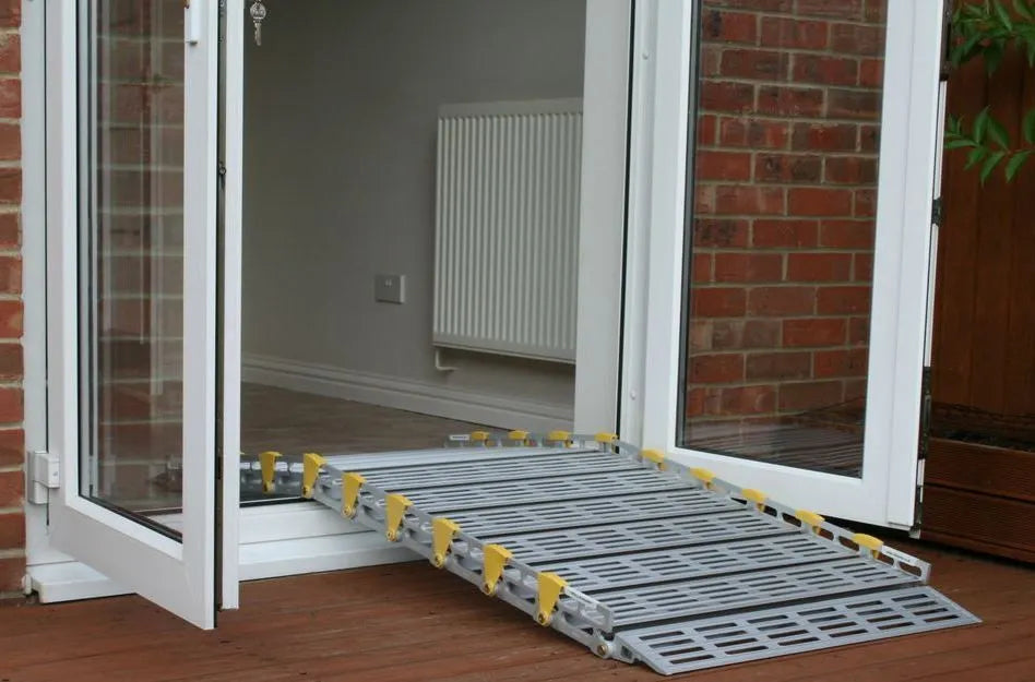 roll-a-ramp portable aluminum wheelchair ramp at reliable ramps being used at a sliding door on a patio