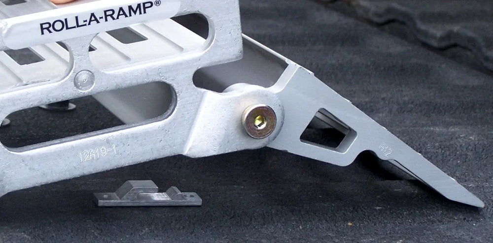 Roll-A-Ramp Pickup truck tailgate brackets on reliableramps.com underneath a ramp about to be hooked up