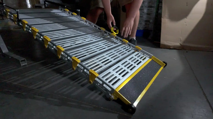 roll-a-ramps assisted bi fold van ramp on reliable ramps zoomed in grabbing handles