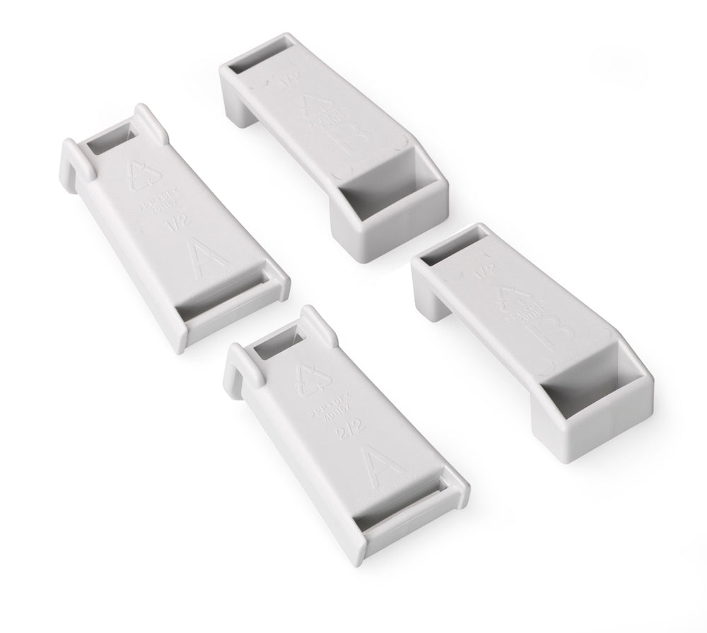 Four white rectangular plastic components on a white background