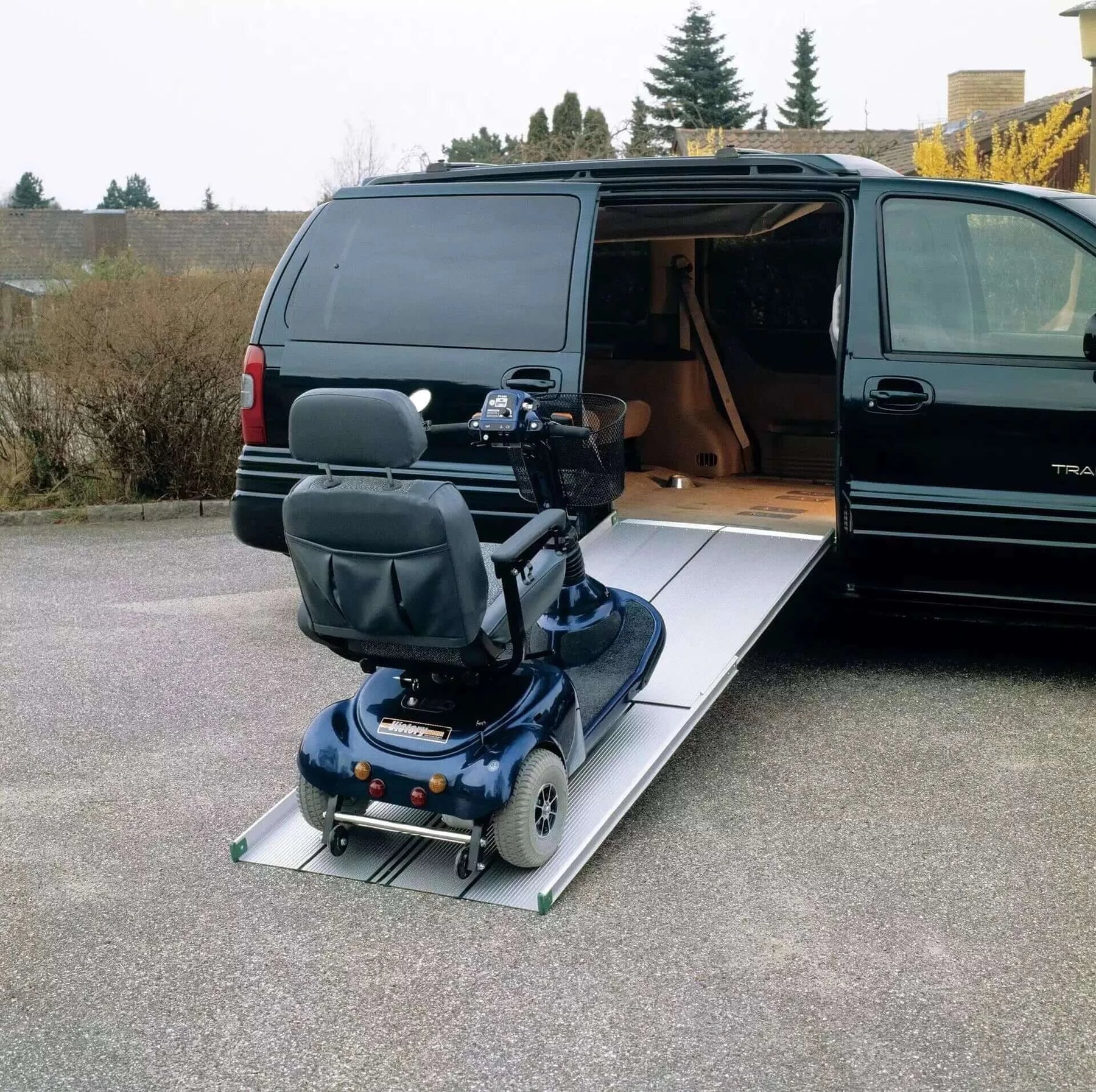 guldmann telescopic van ramp being used with a minivan