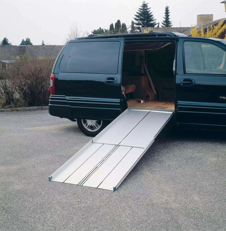 Guldmann - Stepless Telescopic EasyFold Wheelchair Van Ramp setup on the side entrance of a van