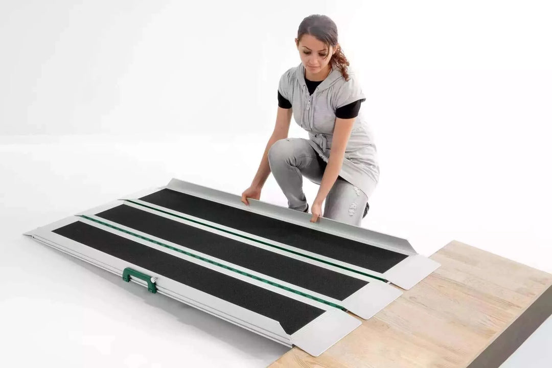 Guldmann - Stepless EasyFold Pro3 Portable Wheelchair Ramp unfolded by a user ready to use