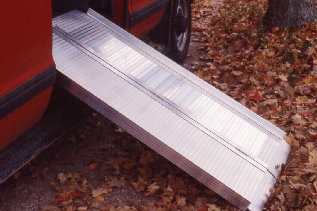AlumiLite Folding Wheelchair Curb Ramp - coming out of a red van