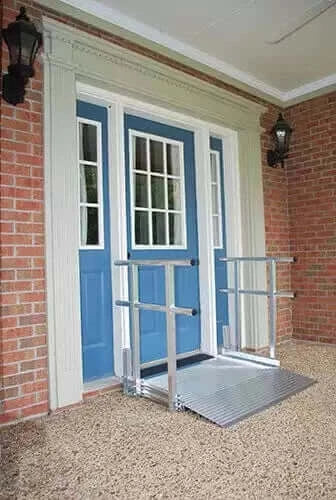 American Access - Big Lug Aluminum Modular Wheelchair Ramp - side view of ramp being used at a home's main entrance