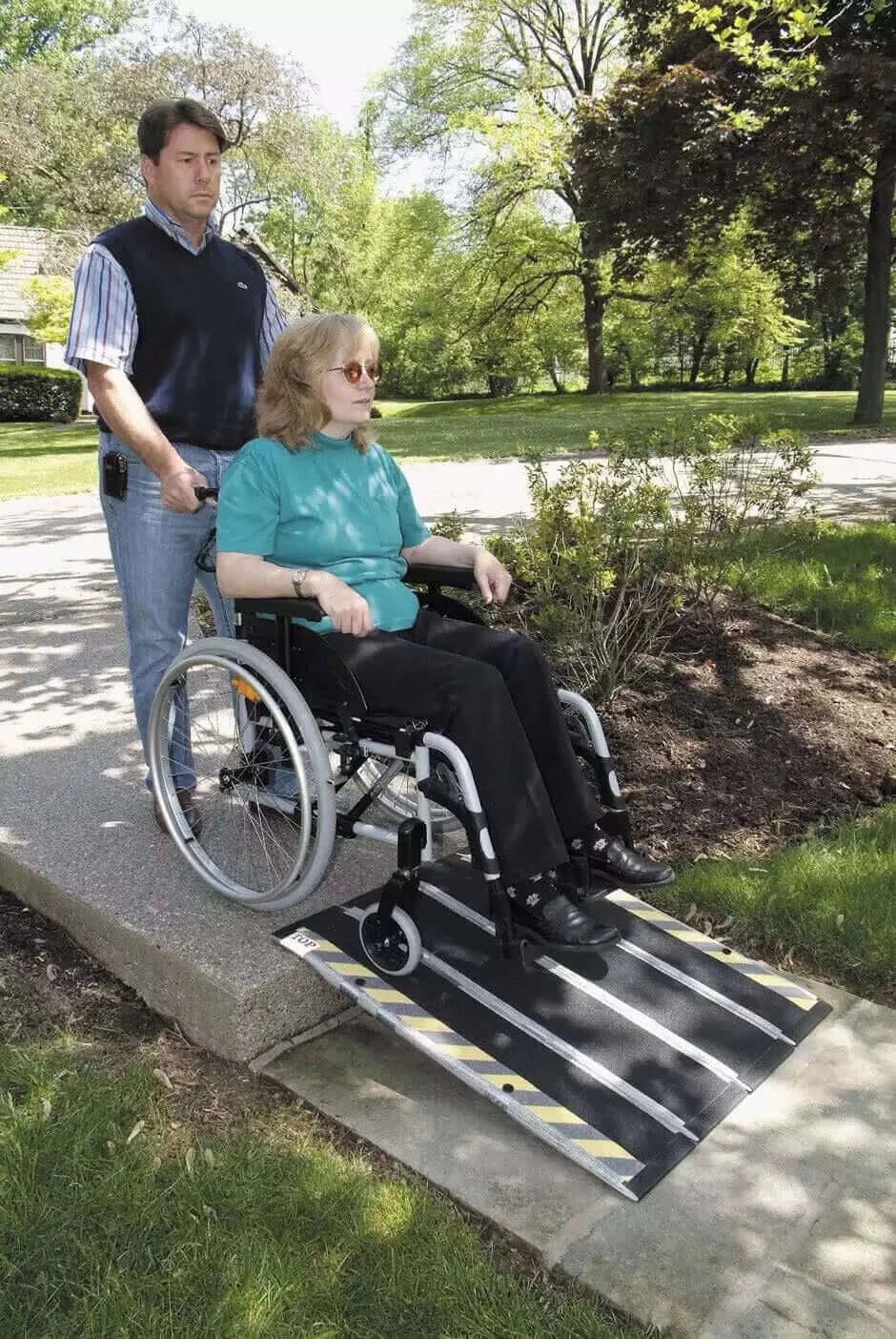 DECPAC - Portable Fiberglass Folding Wheelchair Ramp - lady using it outside over a small threshold