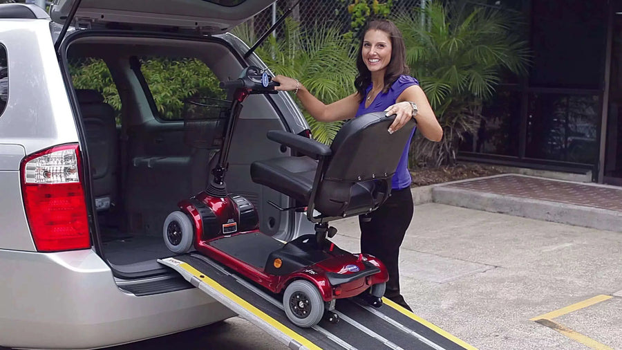 DECPAC - Fiberglass Portable Wheelchair Van Ramp - 5'5" Length - lady using at the back of a van with a scooter