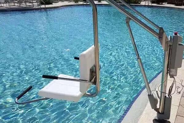 Spectrum Aquatics - Motion Trek BP 400 Deluxe Lift with Anchor installed next to an in ground pool