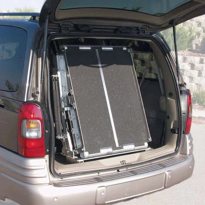 PVI - Multi-Fold Rear Door Mountable Van Wheelchair Ramp folded up inside a van