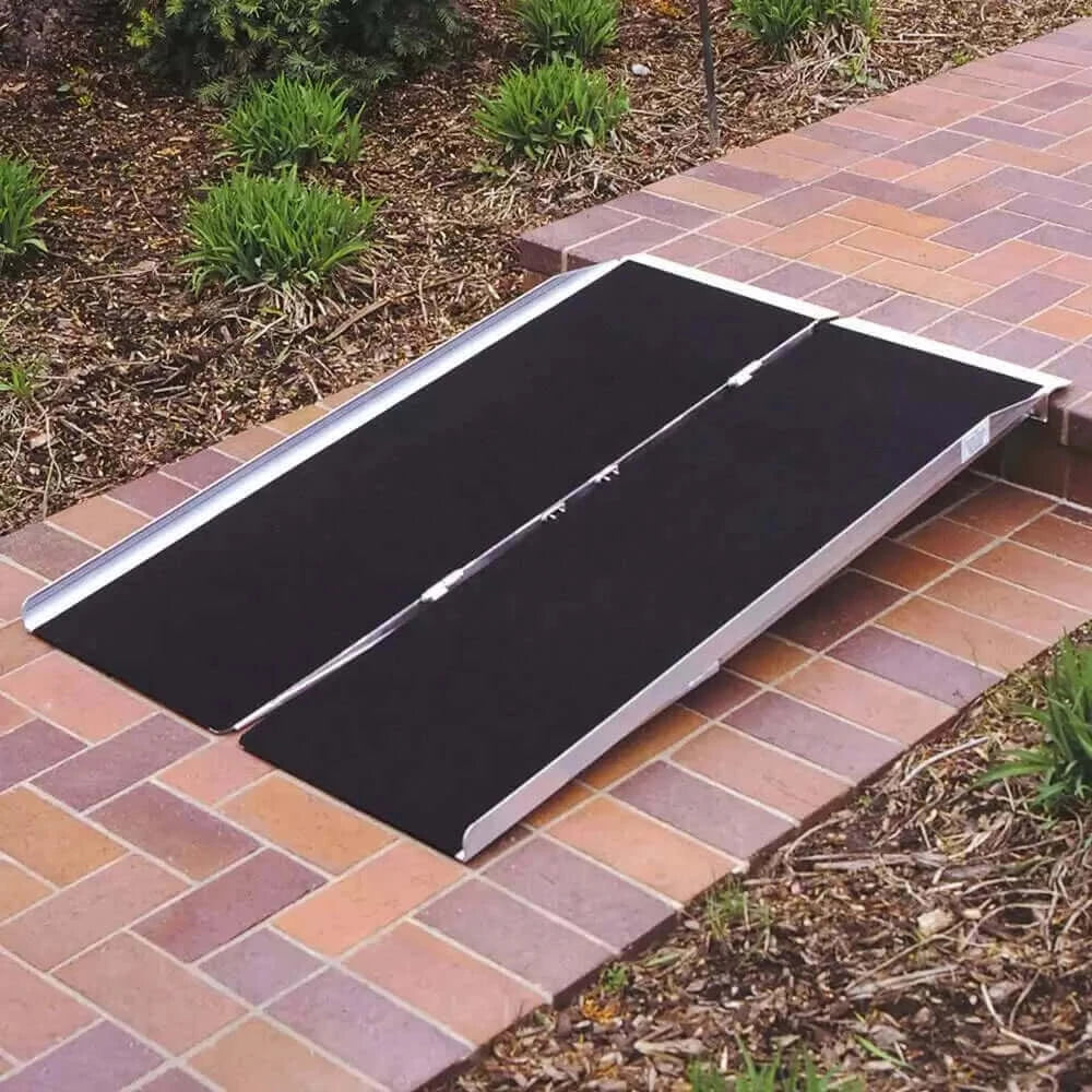 PVI - Aluminum Single Fold Threshold Ramp for Wheelchairs being used on a one step threshold