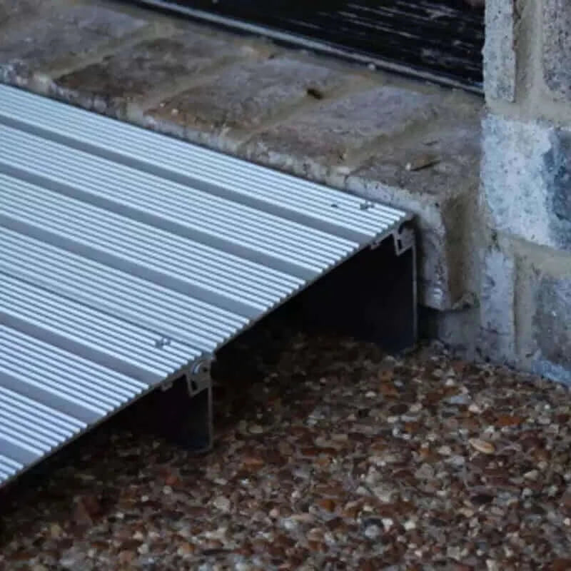 American Access - Hero Aluminum Threshold Ramp for Wheelchairs - zoomed in showing ramp butted up against the threshold
