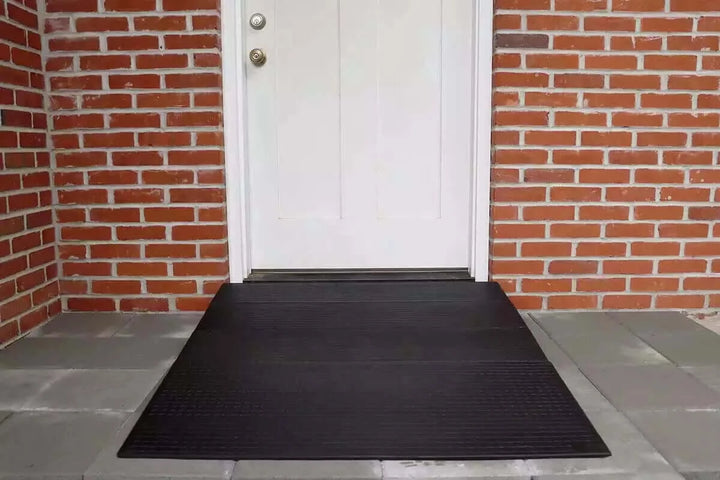 National Ramp - Approach Series Rubber Threshold Ramp for Wheelchairs - image that shows the ramp in front of a door