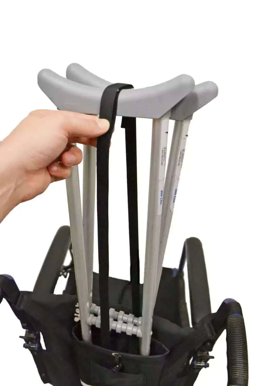 Diestco - Crutch Holder for Wheelchairs with person putting crutches in it