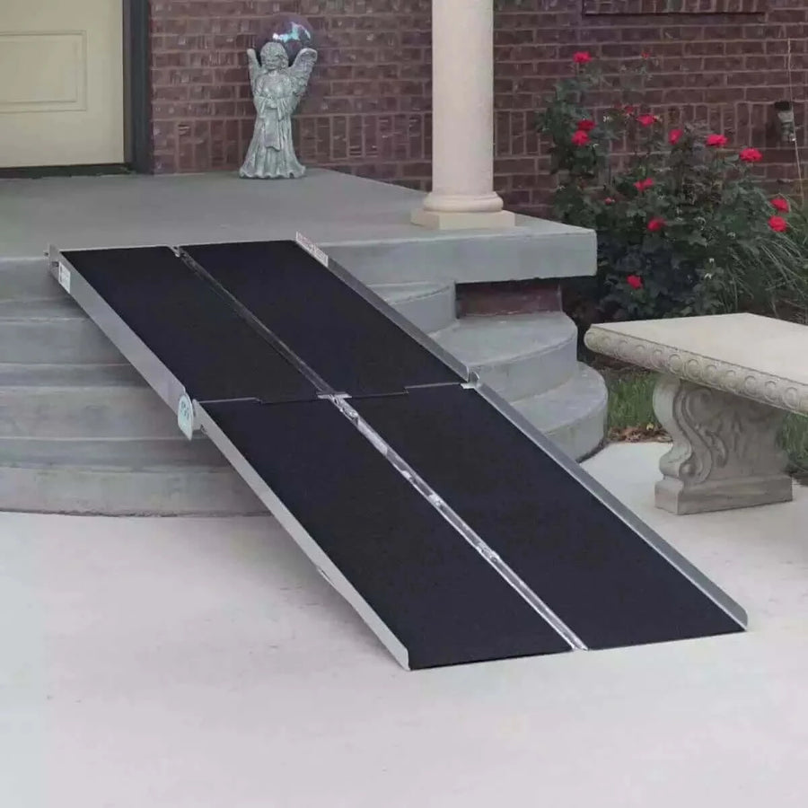PVI - Aluminum Multi-Fold Portable Wheelchair Ramp being shown going over a few steps at a home's entrance