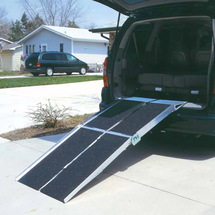 PVI - Aluminum Multi-Fold Rear Door Reach Portable Van Wheelchair Ramp being shown coming off the back of a minivan