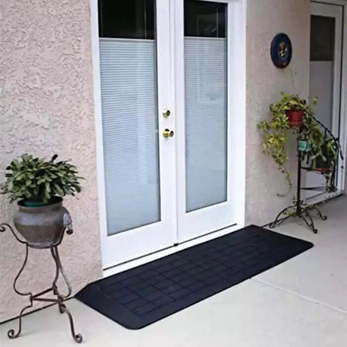 PVI - Rubber Threshold Portable Wheelchair Ramp being used in front of a patio door