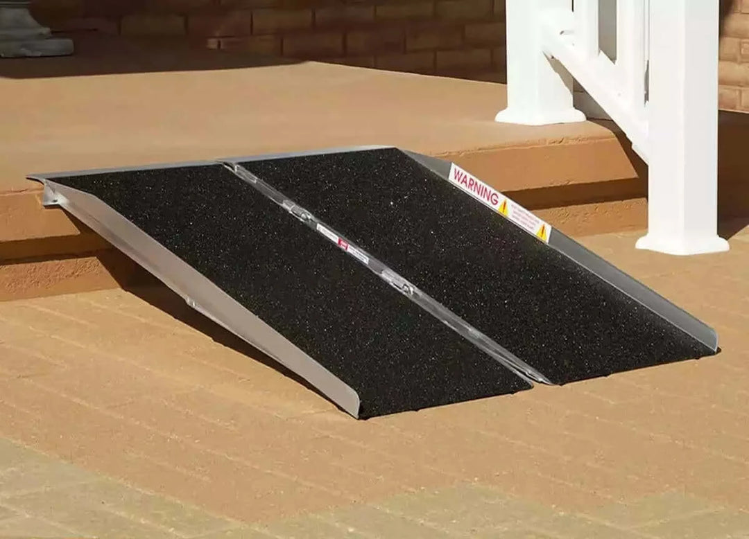PVI - Aluminum Single Fold Threshold Ramp for Wheelchairs being used on a one step threshold in front of a house