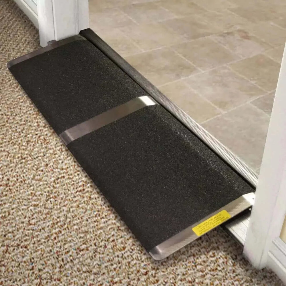 PVI - Aluminum Standard Solid Threshold Ramp for Wheelchairs being used on a small doorway threshold