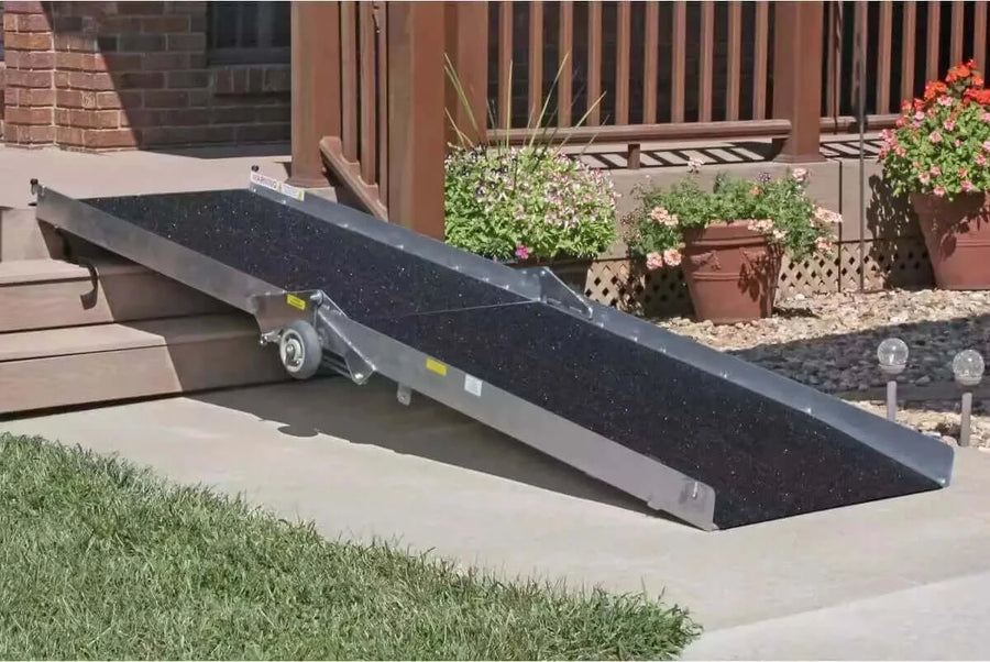 PVI - Wheel-A-Bout Aluminum Portable Wheelchair Ramp being used over a few steps at a home's main entrance