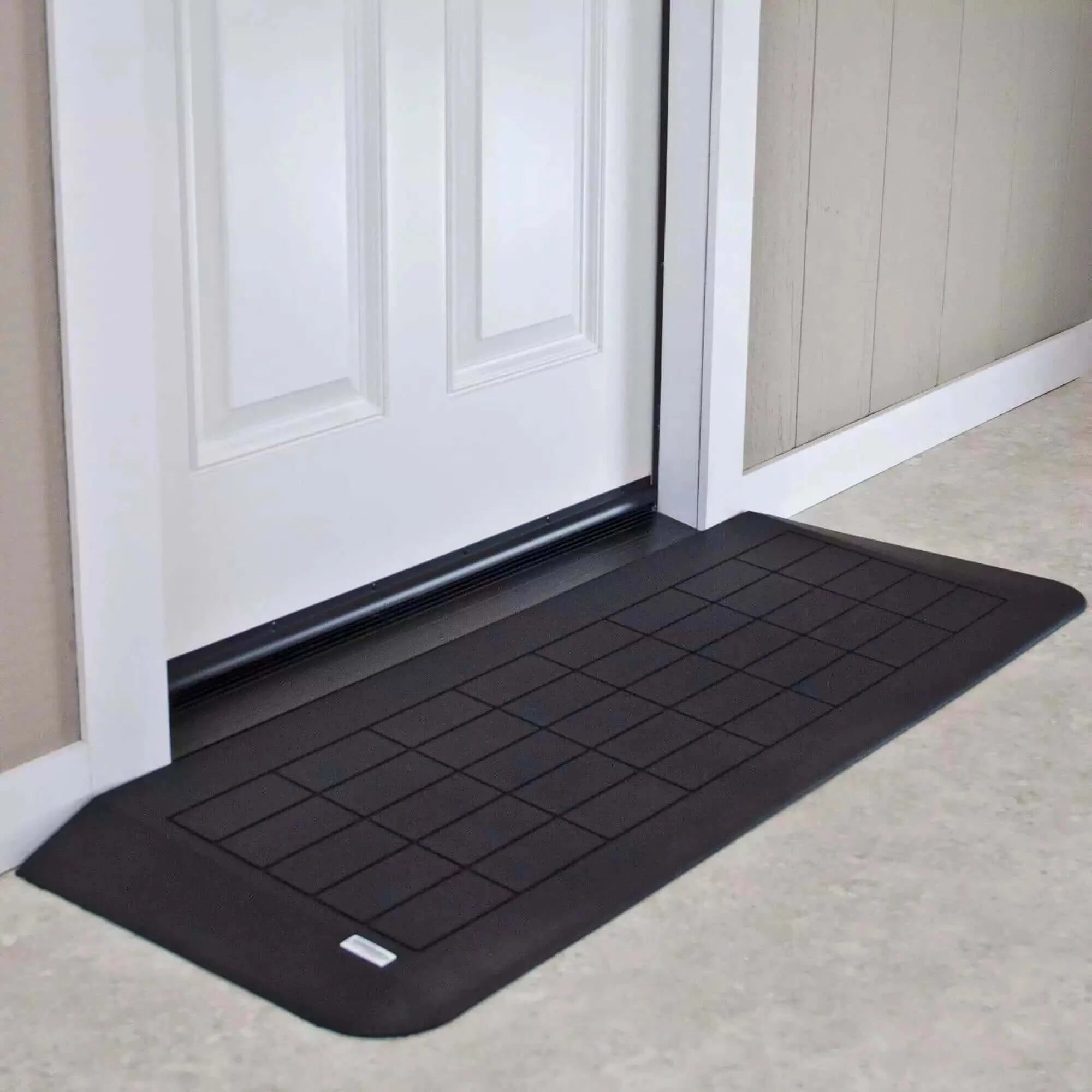 rubber threshold ramp in front of white door