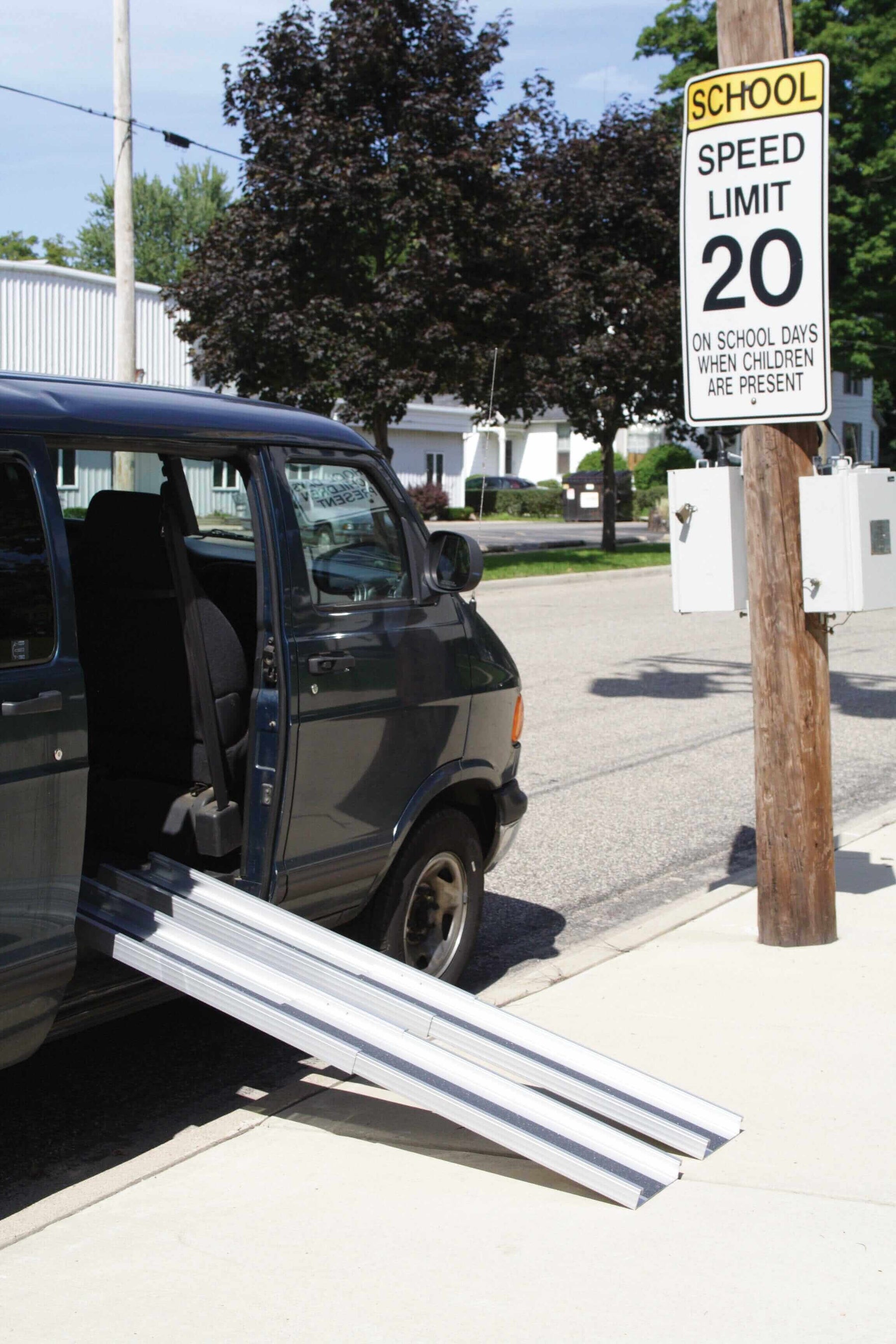 AlumiLite Telescopic Aluminum Wheelchair Van Channel Ramp being used with a van