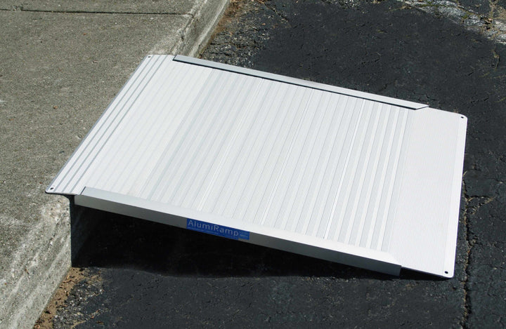 AlumiRamp - Aluminum Threshold Ramp for Wheelchairs - side view going up a curb